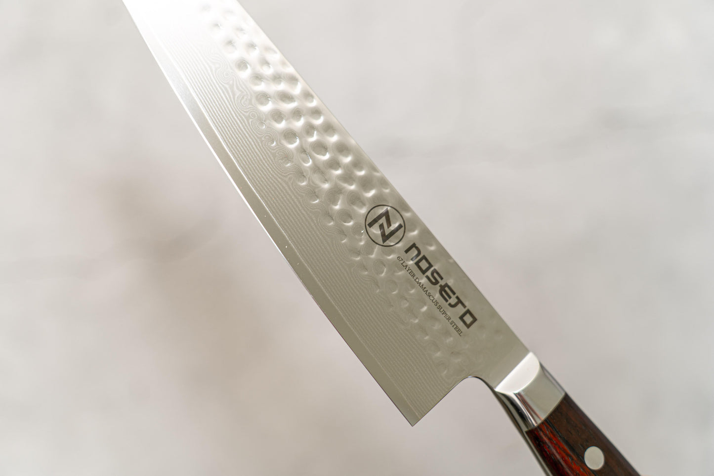 Couteau de poche Noseto Yohan en acier damas martelé 210 mm, manche occidental en palissandre